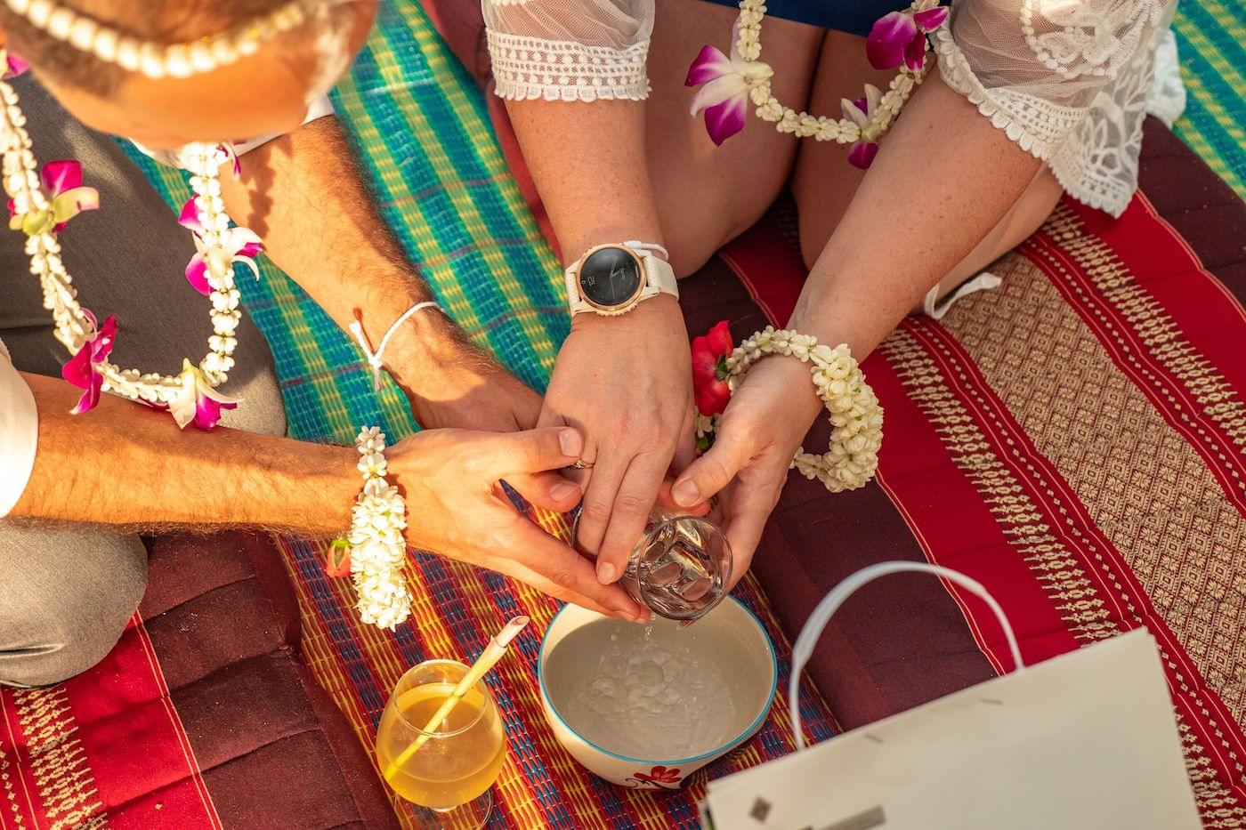 Celebrating on beach with traditional drink in ornate cup